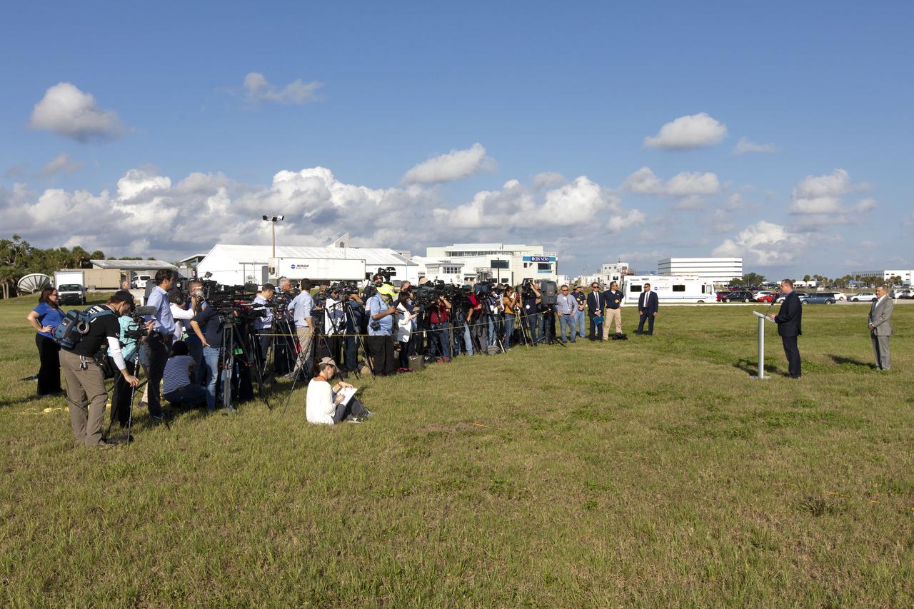 NASA Administrator Jim Bridenstine, at the podium, speaks to members of the news media at the NASA News Center on May 23, 2019. At far right is Kennedy Space Center Director Bob Cabana. News media were at the center for an Apollo 11 Media Day. They toured several facilities, including the Vehicle Assembly and Launch Complex 39B for a look back at the Apollo missions and a look ahead to NASA’s new Moon 2024 initiative, the Artemis 1 mission and the Gateway lunar outpost.