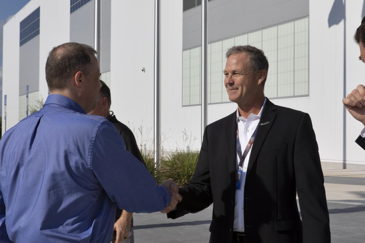 NASA Administrator Jim Bridenstine shakes hands with Scott Henderson, Blue Origin Orbital Launch director, at the Blue Origin facilities near the agency’s Kennedy Space Center in Florida on May 23, 2019. Bridenstine toured the facilities and viewed the New Shepard booster and crew capsule that flew to space and back five times.