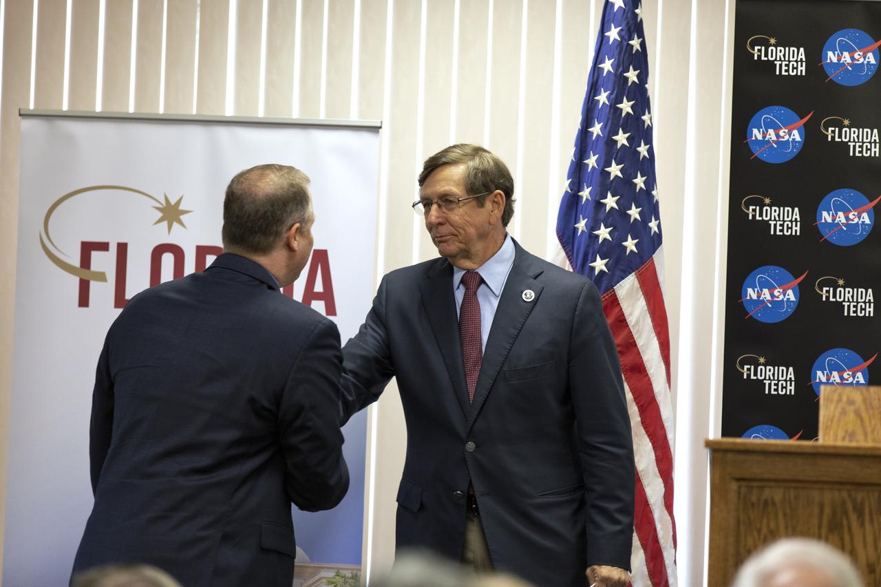 NASA Administrator Jim Bridenstine, left, shakes hands with Florida Institute of Technology President T. Dwayne McCay on Thursday, May 23, 2019 at the Melbourne, FL campus. Bridenstine delivered the keynote address during the university’s Space Technology Day. Among the key topics Bridenstine discussed was NASA’s Artemis missions to the Moon, including the lunar Gateway, which will serve as an orbiting outpost for astronauts.