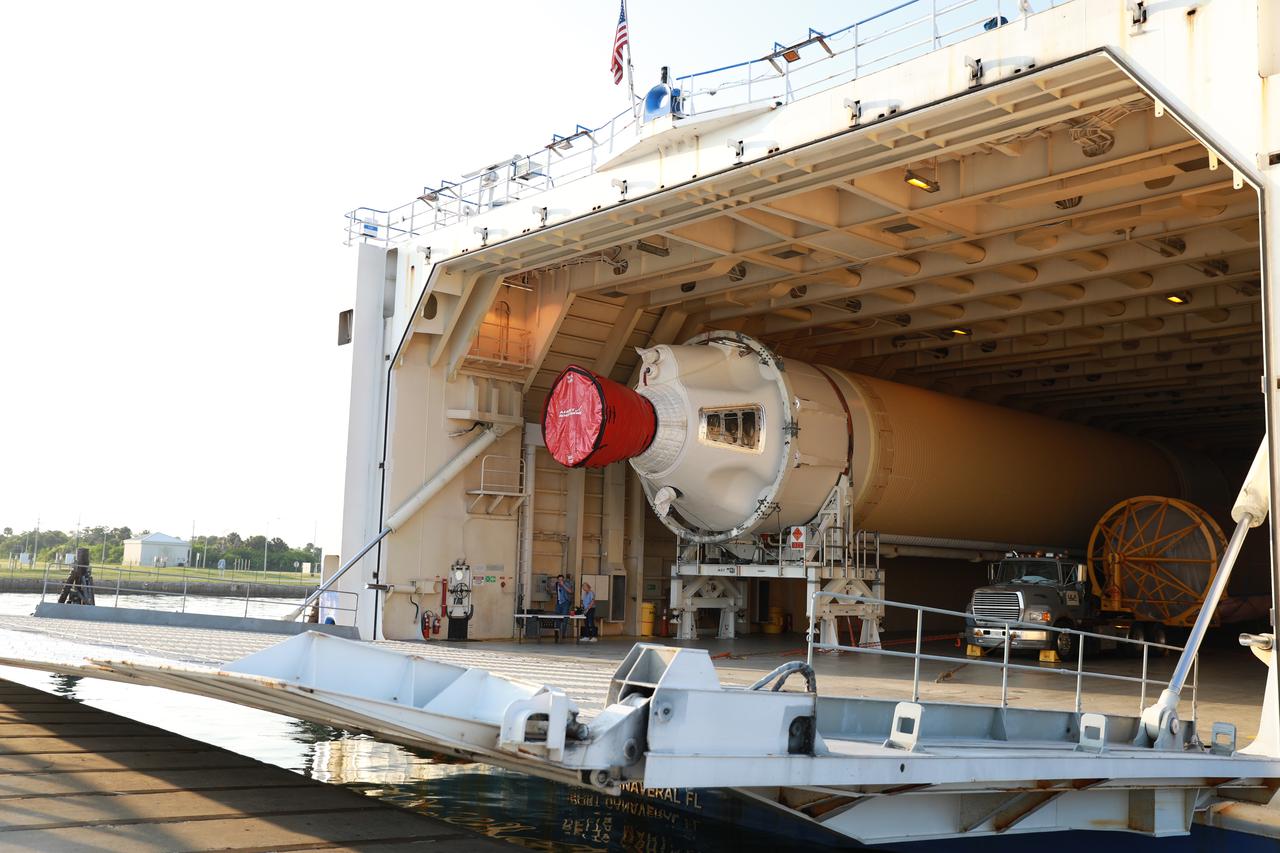 At the Army Wharf at Cape Canaveral Air Force Station in Florida, the United Launch Alliance (ULA) Mariner cargo ship door is lowered on June 5, 2019, for offloading of the ULA Atlas V booster that will be used for Boeing’s Crew Flight Test (CFT). The Atlas V rocket will launch the CST-100 Starliner spacecraft and its crew, NASA astronauts Mike Fincke and Nicole Mann and Boeing astronaut Chris Ferguson, to the International Space Station for NASA’s Commercial Crew Program. The booster will be transported to the Atlas Spaceflight Operations Center to await the start of operations for its mission. The CFT will demonstrate Starliner and Atlas V’s ability to safely carry crew to and from the orbiting laboratory.