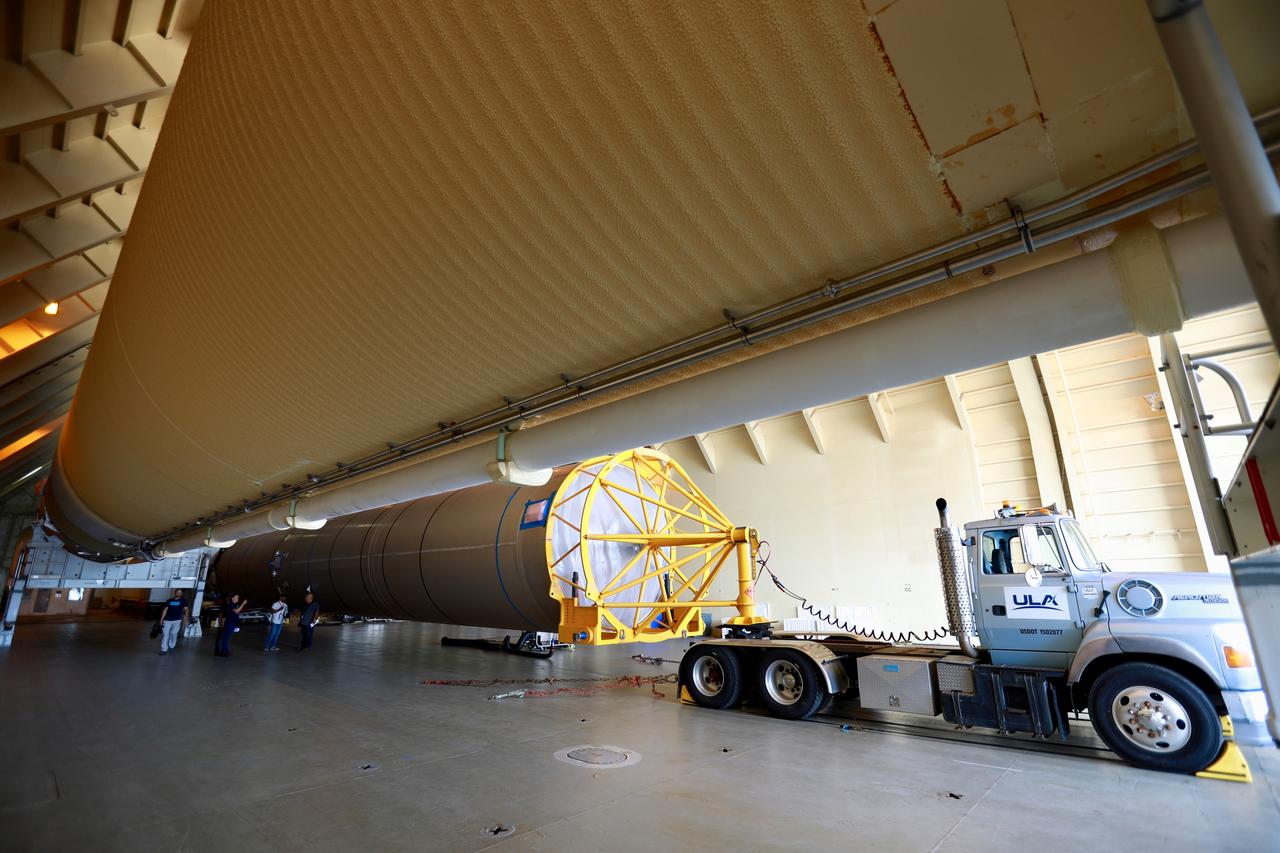 The United Launch Alliance (ULA) Atlas V booster that will be used for Boeing’s Crew Flight Test (CFT) is moved out of the Mariner cargo ship at the Army Wharf at Cape Canaveral Air Force Station in Florida on June 5, 2019. The ULA Atlas V rocket will launch the CST-100 Starliner and its crew, NASA astronauts Mike Fincke and Nicole Mann and Boeing astronaut Chris Ferguson, to the International Space Station for NASA’s Commercial Crew Program. The booster will be transported to the Atlas Spaceflight Operations Center to await the start of operations for its missions. The CFT will demonstrate Starliner and Atlas V’s ability to safely carry crew to and from the orbiting laboratory.