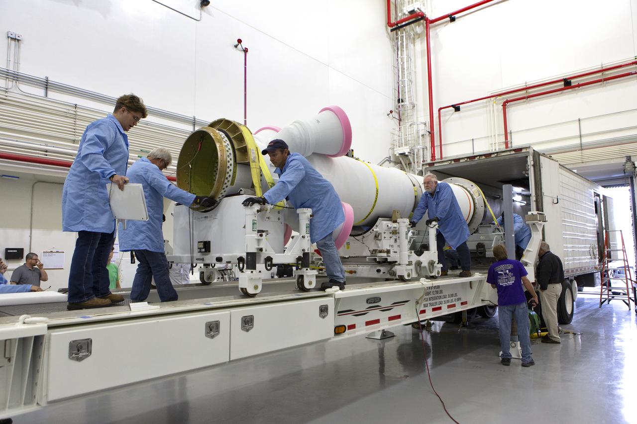 Workers offload the abort motor for NASA’s Artemis 1 mission from a heavy transport truck inside the Launch Abort System Facility (LASF) at the agency’s Kennedy Space Center in Florida on June 6, 2019. The abort motor, manufactured by Northrop Grumman, will be integrated with Orion subcomponents and prepared for Artemis 1. The abort motor is one of three motors located on the tower of the Launch Abort System (LAS). The LAS is designed to pull the Orion capsule and its crew away to safety if an emergency occurs during ascent of the Space Launch System (SLS) rocket. During Artemis 1, the uncrewed Orion spacecraft will launch atop the SLS from Launch Pad 39B at Kennedy. Orion will embark on an approximately three-week mission that will take the spacecraft thousands of miles past the Moon. Orion will return to Earth and splashdown in the Pacific Ocean off the coast of California, where it will be retrieved and returned to Kennedy.