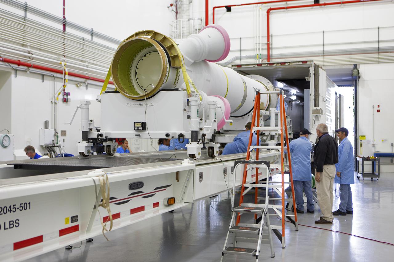 Workers help offload the abort motor for NASA’s Artemis 1 mission from a heavy transport truck inside the Launch Abort System Facility (LASF) at the agency’s Kennedy Space Center in Florida on June 6, 2019. The abort motor, manufactured by Northrop Grumman, will be integrated with Orion subcomponents and prepared for Artemis 1. The abort motor is one of three motors located on the tower of the Launch Abort System (LAS). The LAS is designed to pull the Orion capsule and its crew away to safety if an emergency occurs during ascent of the Space Launch System (SLS) rocket. During Artemis 1, the uncrewed Orion spacecraft will launch atop the SLS from Launch Pad 39B at Kennedy. Orion will embark on an approximately three-week mission that will take the spacecraft thousands of miles past the Moon. Orion will return to Earth and splashdown in the Pacific Ocean off the coast of California, where it will be retrieved and returned to Kennedy.