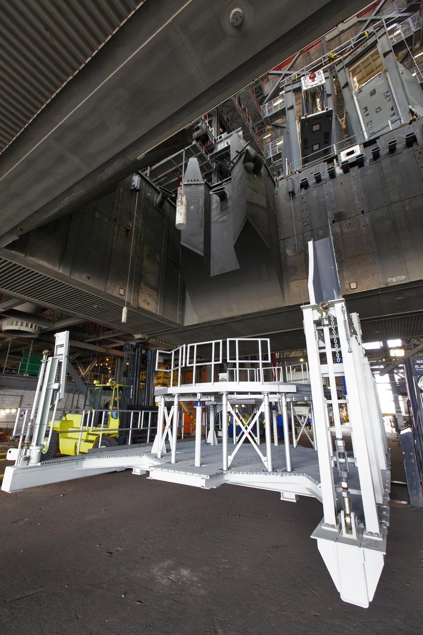 The engine service platform that will provide access to the core stage of the Space Launch System (SLS) rocket arrives in High Bay 3 of the Vehicle Assembly Building at NASA’s Kennedy Space Center in Florida on June 14, 2019. The large work platform is designed to provide unrestricted access to the RS-25 engines on the SLS core stage from the ML. The service platform will be used for Artemis 1 and subsequent missions. For Artemis 1, the Orion spacecraft will launch atop the SLS rocket from Launch Pad 39B and begin an approximately three-week mission that will send Orion thousands of miles beyond the Moon. Exploration Ground Systems is overseeing work on the ML.