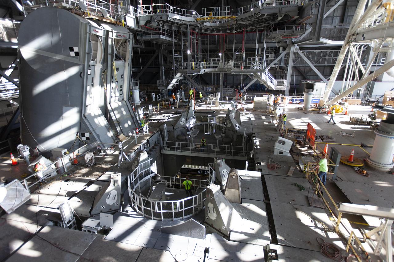 Inside the Vehicle Assembly Building at NASA’s Kennedy Space Center in Florida, the engine service platform that will provide access to the core stage of the Space Launch System (SLS) rocket is lifted up in the center of the mobile launcher (ML) in High Bay 3 on June 18, 2019. The large work platform is designed to provide unrestricted access to the RS-25 engines on the SLS core stage from the ML. The service platform will be used for Artemis 1 and subsequent missions. For Artemis 1, the Orion spacecraft will launch atop the SLS rocket from Launch Pad 39B and begin an approximately three-week mission that will send Orion thousands of miles beyond the Moon. Exploration Ground Systems is overseeing work on the ML.