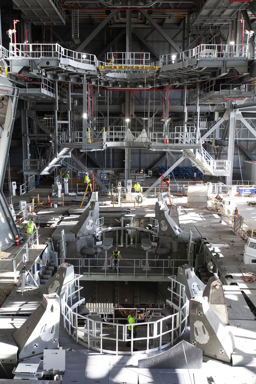 Inside the Vehicle Assembly Building at NASA’s Kennedy Space Center in Florida, the engine service platform that will provide access to the core stage of the Space Launch System (SLS) rocket is lifted up in the center of the mobile launcher (ML) in High Bay 3 on June 18, 2019. The large work platform is designed to provide unrestricted access to the RS-25 engines on the SLS core stage from the ML. The service platform will be used for Artemis 1 and subsequent missions. For Artemis 1, the Orion spacecraft will launch atop the SLS rocket from Launch Pad 39B and begin an approximately three-week mission that will send Orion thousands of miles beyond the Moon. Exploration Ground Systems is overseeing work on the ML.