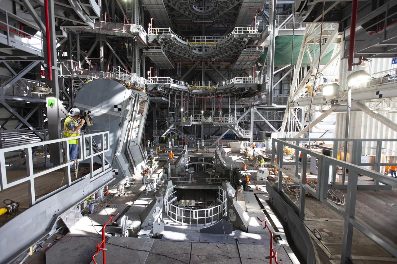 Inside the Vehicle Assembly Building at NASA’s Kennedy Space Center in Florida, the engine service platform that will provide access to the core stage of the Space Launch System (SLS) rocket is lifted up in the center of the mobile launcher (ML) in High Bay 3 on June 18, 2019. The large work platform is designed to provide unrestricted access to the RS-25 engines on the SLS core stage from the ML. The service platform will be used for Artemis 1 and subsequent missions. For Artemis 1, the Orion spacecraft will launch atop the SLS rocket from Launch Pad 39B and begin an approximately three-week mission that will send Orion thousands of miles beyond the Moon. Exploration Ground Systems is overseeing work on the ML.