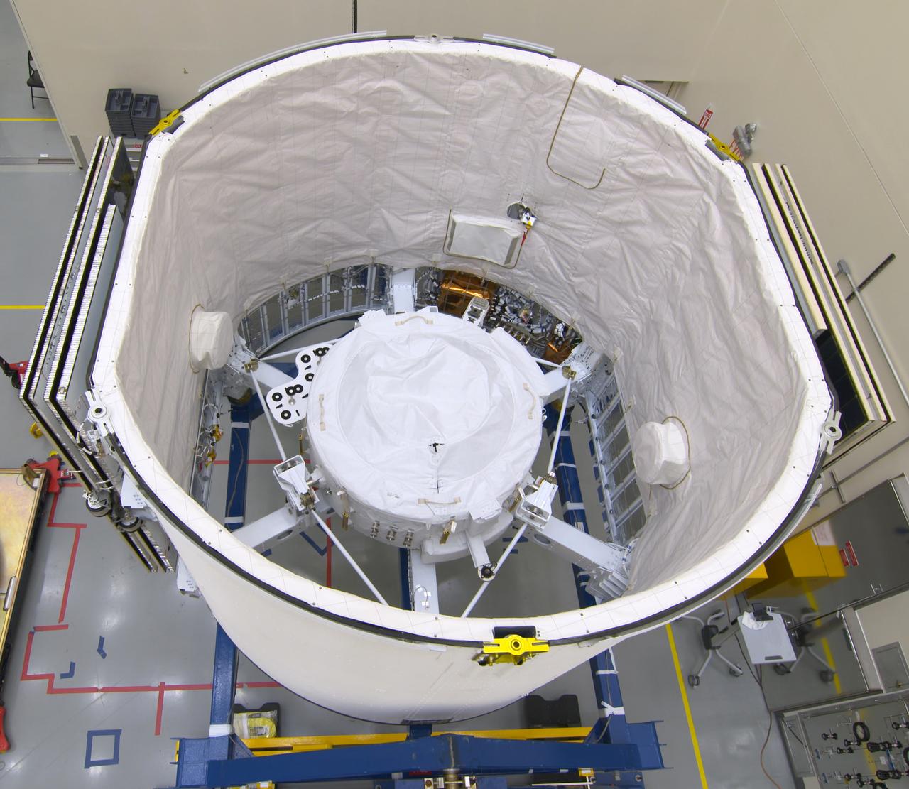 The International Docking Adapter 3, a critical component for future crewed missions to the International Space Station, is carefully packed away in the unpressurized “trunk” section of the SpaceX Dragon spacecraft at the SpaceX facility on Cape Canaveral Air Force Station in Florida on June 19. It will launch to the orbiting laboratory in July on the company’s 18th commercial resupply mission. The adapter will support future U.S. crewed vehicles visiting the station.