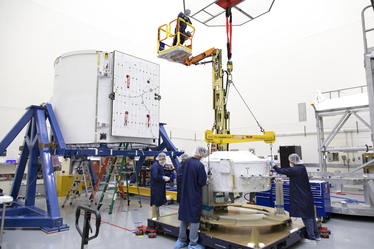 The International Docking Adapter 3, a critical component for future crewed missions to the International Space Station, is carefully packed away in the unpressurized “trunk” section of the SpaceX Dragon spacecraft at the SpaceX facility on Cape Canaveral Air Force Station in Florida on June 19. It will launch to the orbiting laboratory in July on the company’s 18th commercial resupply mission. The adapter will support future U.S. crewed vehicles visiting the station.