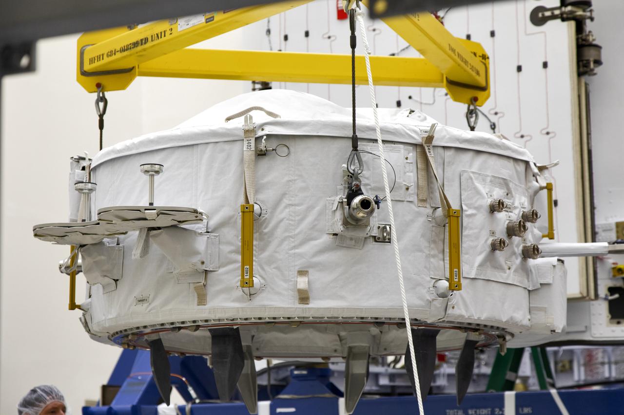 The International Docking Adapter 3, a critical component for future crewed missions to the International Space Station, is carefully packed away in the unpressurized “trunk” section of the SpaceX Dragon spacecraft at the SpaceX facility on Cape Canaveral Air Force Station in Florida on June 19. It will launch to the orbiting laboratory in July on the company’s 18th commercial resupply mission. The adapter will support future U.S. crewed vehicles visiting the station.