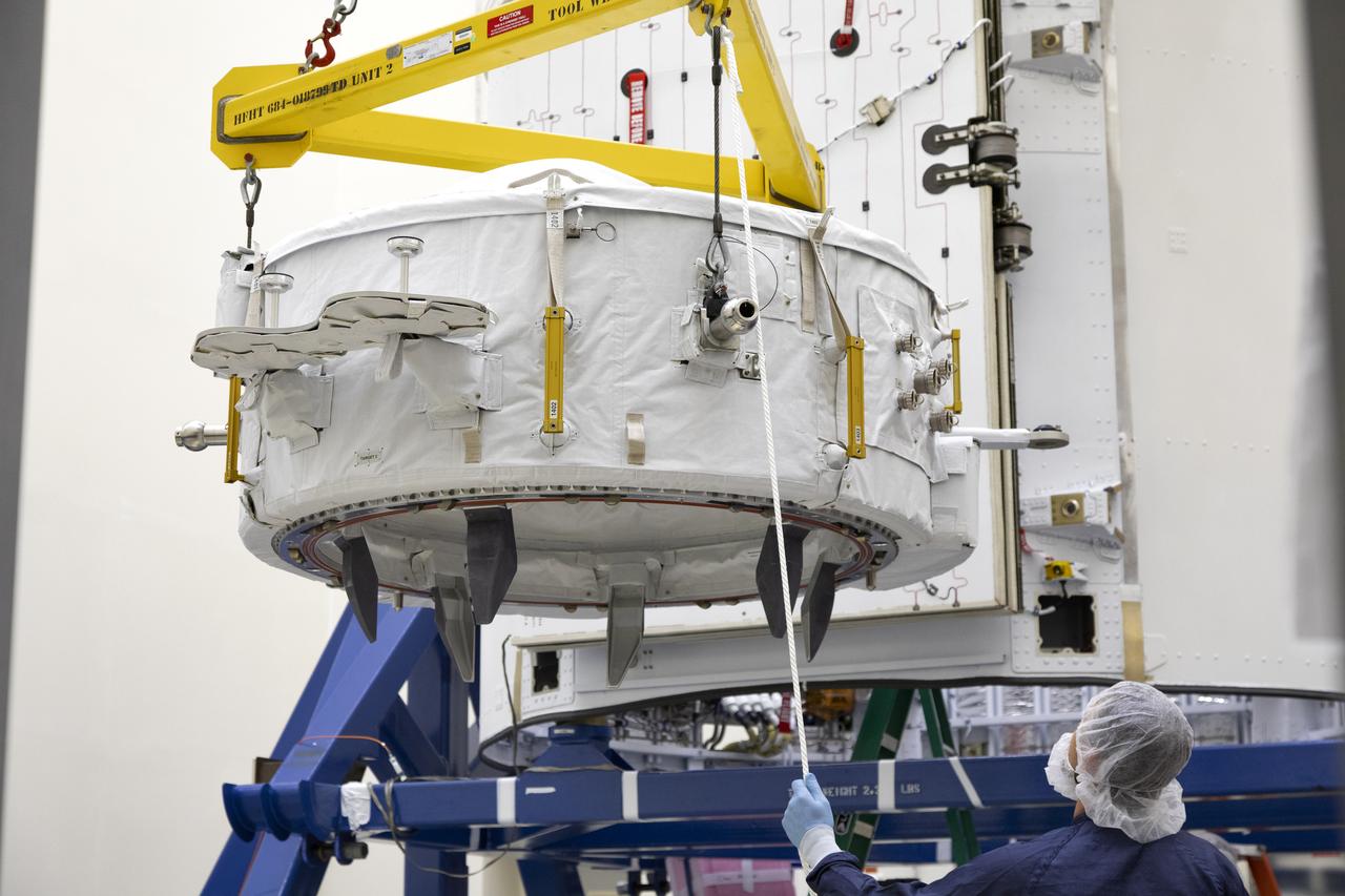 The International Docking Adapter 3, a critical component for future crewed missions to the International Space Station, is carefully packed away in the unpressurized “trunk” section of the SpaceX Dragon spacecraft at the SpaceX facility on Cape Canaveral Air Force Station in Florida on June 19. It will launch to the orbiting laboratory in July on the company’s 18th commercial resupply mission. The adapter will support future U.S. crewed vehicles visiting the station.