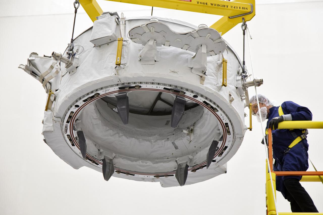 The International Docking Adapter 3, a critical component for future crewed missions to the International Space Station, is carefully packed away in the unpressurized “trunk” section of the SpaceX Dragon spacecraft at the SpaceX facility on Cape Canaveral Air Force Station in Florida on June 19. It will launch to the orbiting laboratory in July on the company’s 18th commercial resupply mission. The adapter will support future U.S. crewed vehicles visiting the station.