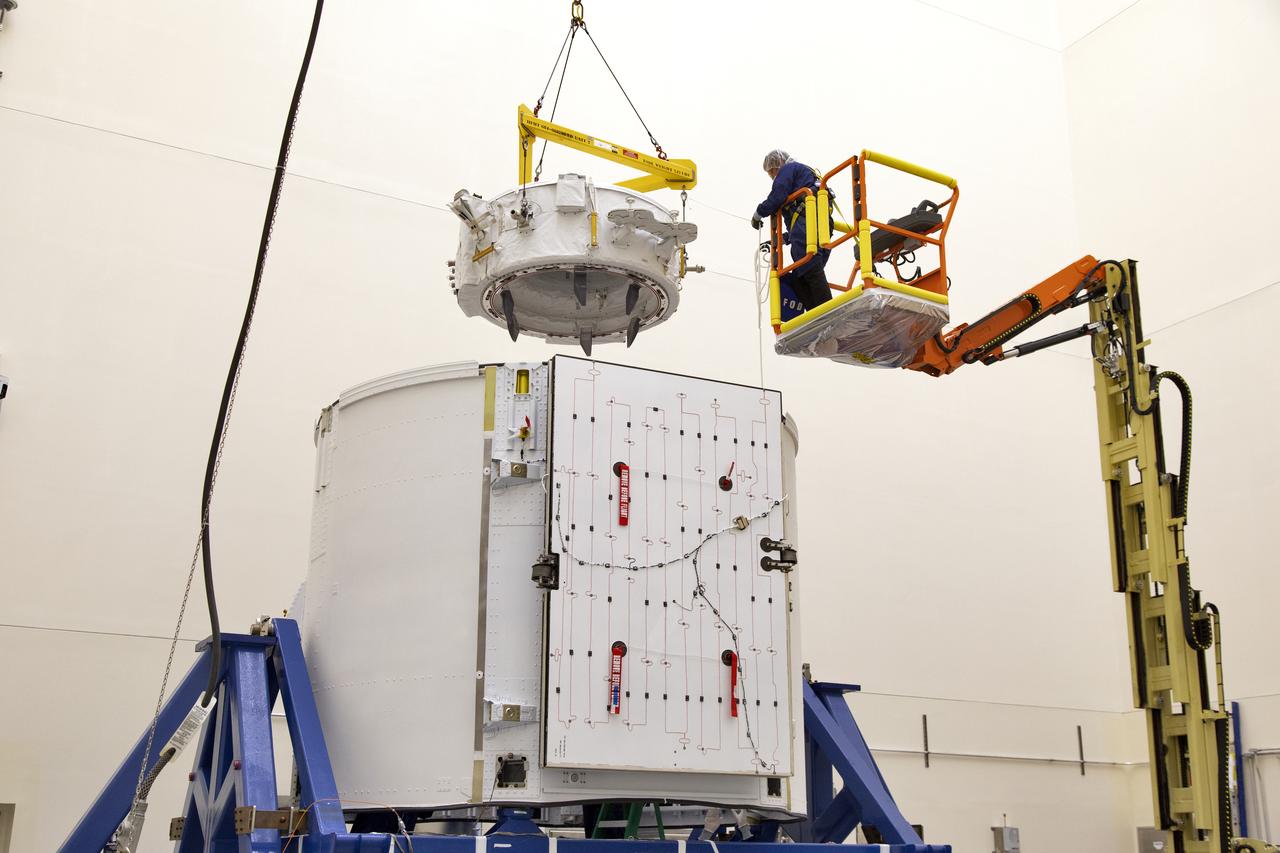 The International Docking Adapter 3, a critical component for future crewed missions to the International Space Station, is carefully packed away in the unpressurized “trunk” section of the SpaceX Dragon spacecraft at the SpaceX facility on Cape Canaveral Air Force Station in Florida on June 19. It will launch to the orbiting laboratory in July on the company’s 18th commercial resupply mission. The adapter will support future U.S. crewed vehicles visiting the station.