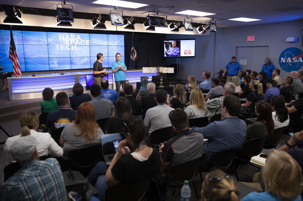 Chris McLean, (right) principal investigator for NASA’s Green Propellant Infusion Mission at Ball Aerospace, and Joe Cassady, (left), executive director of space at Aeroject Rocketdyne, explain the payload during a NASA prelaunch technology TV broadcast for the Space Test Program-2 (STP-2) mission at NASA’s Kennedy Space Center in Florida on June 23, 2019. The payload will help demonstrate this low toxicity, increased performance propellant and related systems so it can become a viable solution for future satellites. It is one of four NASA payloads scheduled to launch on a SpaceX Falcon Heavy rocket from Launch Complex 39A beginning at 11:30 p.m. EDT on June 24, 2019. STP-2 is managed by the U.S. Air Force Space and Missile Systems Center.