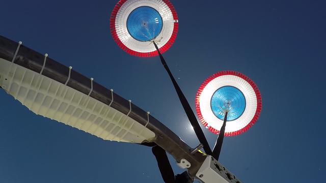 In this view looking up, Boeing’s CST-100 Starliner’s parachutes deploy above the U.S. Army’s White Sands Missile Range in New Mexico during parachute system testing on June 24, 2019. Boeing conducted the test using a full-scale Starliner test article, known as a boiler plate, designed to simulate the actual spacecraft. The test involved intentionally disabling one of the parachute system’s two drogue parachutes and one of the three main parachutes to evaluate how the remaining parachutes handled the additional loads during deployment and descent. This was one of a series of important parachute tests to validate the system is safe to carry astronauts to and from the International Space Station as part of NASA’s Commercial Crew Program. Boeing is targeting an uncrewed Orbital Flight Test to the space station this summer, followed by its Crew Flight Test. Starliner will launch atop a United Launch Alliance Atlas V rocket from Space Launch Complex 41 at Cape Canaveral Air Force Station in Florida.