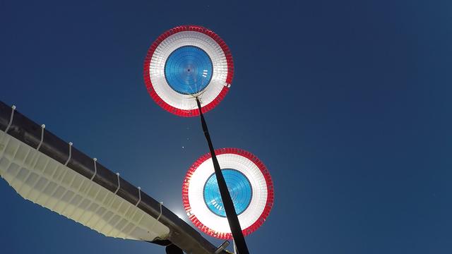 In this view looking up, Boeing’s CST-100 Starliner’s parachutes deploy above the U.S. Army’s White Sands Missile Range in New Mexico during parachute system testing on June 24, 2019. Boeing conducted the test using a full-scale Starliner test article, known as a boiler plate, designed to simulate the actual spacecraft. The test involved intentionally disabling one of the parachute system’s two drogue parachutes and one of the three main parachutes to evaluate how the remaining parachutes handled the additional loads during deployment and descent. This was one of a series of important parachute tests to validate the system is safe to carry astronauts to and from the International Space Station as part of NASA’s Commercial Crew Program. Boeing is targeting an uncrewed Orbital Flight Test to the space station this summer, followed by its Crew Flight Test. Starliner will launch atop a United Launch Alliance Atlas V rocket from Space Launch Complex 41 at Cape Canaveral Air Force Station in Florida. 