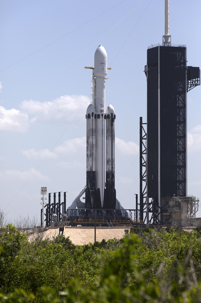 A SpaceX Falcon Heavy rocket is ready for launch on the pad at Launch Complex 39A at NASA’s Kennedy Space Center in Florida on June 24, 2019. SpaceX and the U.S. Department of Defense will launch two dozen satellites to space, including four NASA payloads that are part of the Space Test Program-2, managed by the U.S. Air Force Space and Missile Systems Center. The launch window opens at 11:30 p.m. EDT on June 24. The four NASA payloads include two technology demonstrations to improve how spacecraft propel and navigate, as well as two NASA science missions to help us better understand the nature of space and how it impacts technology on spacecraft and the ground.