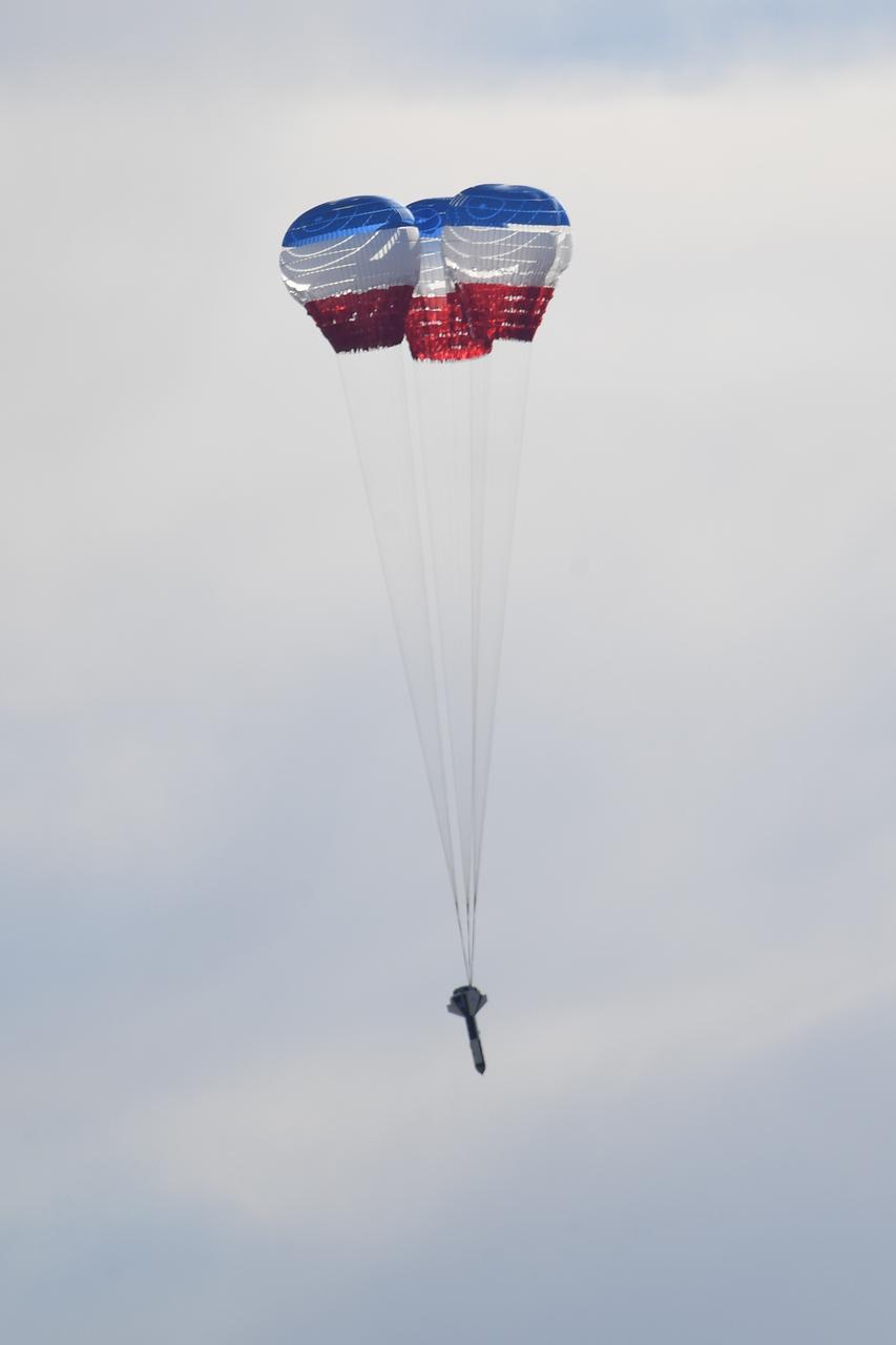 A dart-shaped device, functioning as a Boeing CST-100 Starliner weight simulant, drops from a C-17 aircraft during parachute system testing at the U.S. Army’s Yuma Proving Ground in Arizona on June 26, 2019. This “high Q” test involved intentionally inflating the parachutes at higher pressures than expected during missions, to validate the system is safe to carry astronauts to and from the International Space Station. As part of NASA’s Commercial Crew Program, Boeing is targeting an uncrewed Orbital Flight Test to the space station this summer, followed by its Crew Flight Test. Starliner will launch atop a United Launch Alliance Atlas V rocket from Space Launch Complex 41 at Cape Canaveral Air Force Station in Florida. 