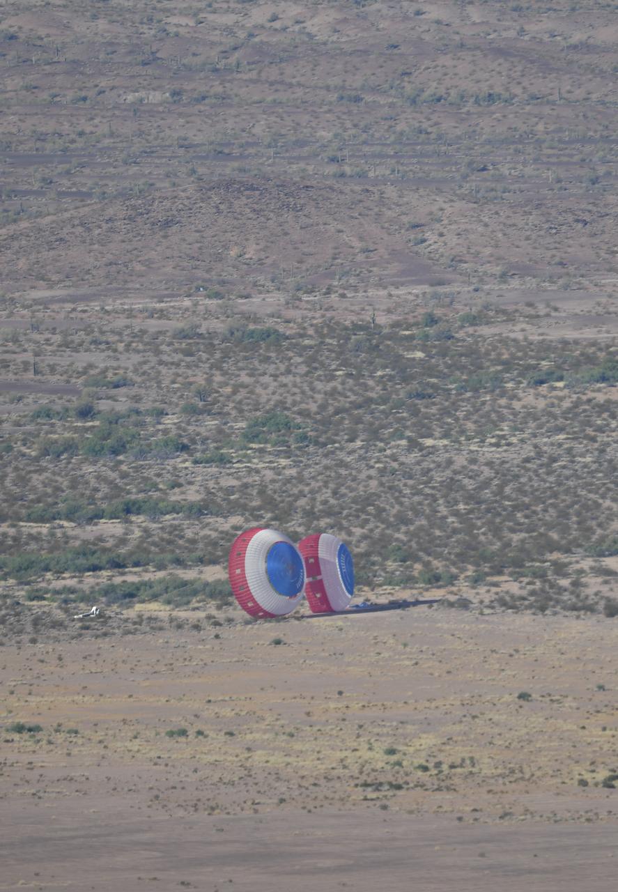 Boeing’s CST-100 Starliner’s parachute system, carrying a dart-shaped device functioning as a Starliner weight simulant, complete a successful landing at the U.S. Army’s Yuma Proving Ground in Arizona on June 26, 2019. This “high Q” test involved dropping the device from a C-17 aircraft and intentionally inflating the parachutes at higher pressures than expected during missions. The data gathered from this parachute test will help validate the system is safe to carry astronauts to and from the International Space Station as part of NASA’s Commercial Crew Program. Boeing is targeting an uncrewed Orbital Flight Test to the space station this summer, followed by its Crew Flight Test. Starliner will launch atop a United Launch Alliance Atlas V rocket from Space Launch Complex 41 at Cape Canaveral Air Force Station in Florida. 