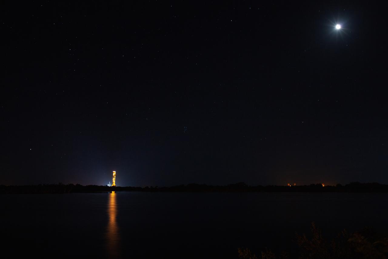With the nighttime sky serving as the backdrop, Exploration Ground Systems’ mobile launcher makes its last solo trek to Kennedy Space Center’s Launch Complex 39B in Florida on June 27, 2019. The mobile launcher departed from the Vehicle Assembly Building at midnight on June 27 for the 10-hour journey to the pad and will remain there for the summer, undergoing final testing and checkouts. Its next roll to the pad will be with the agency’s Space Launch System rocket and Orion spacecraft in preparation for the launch of Artemis 1. 