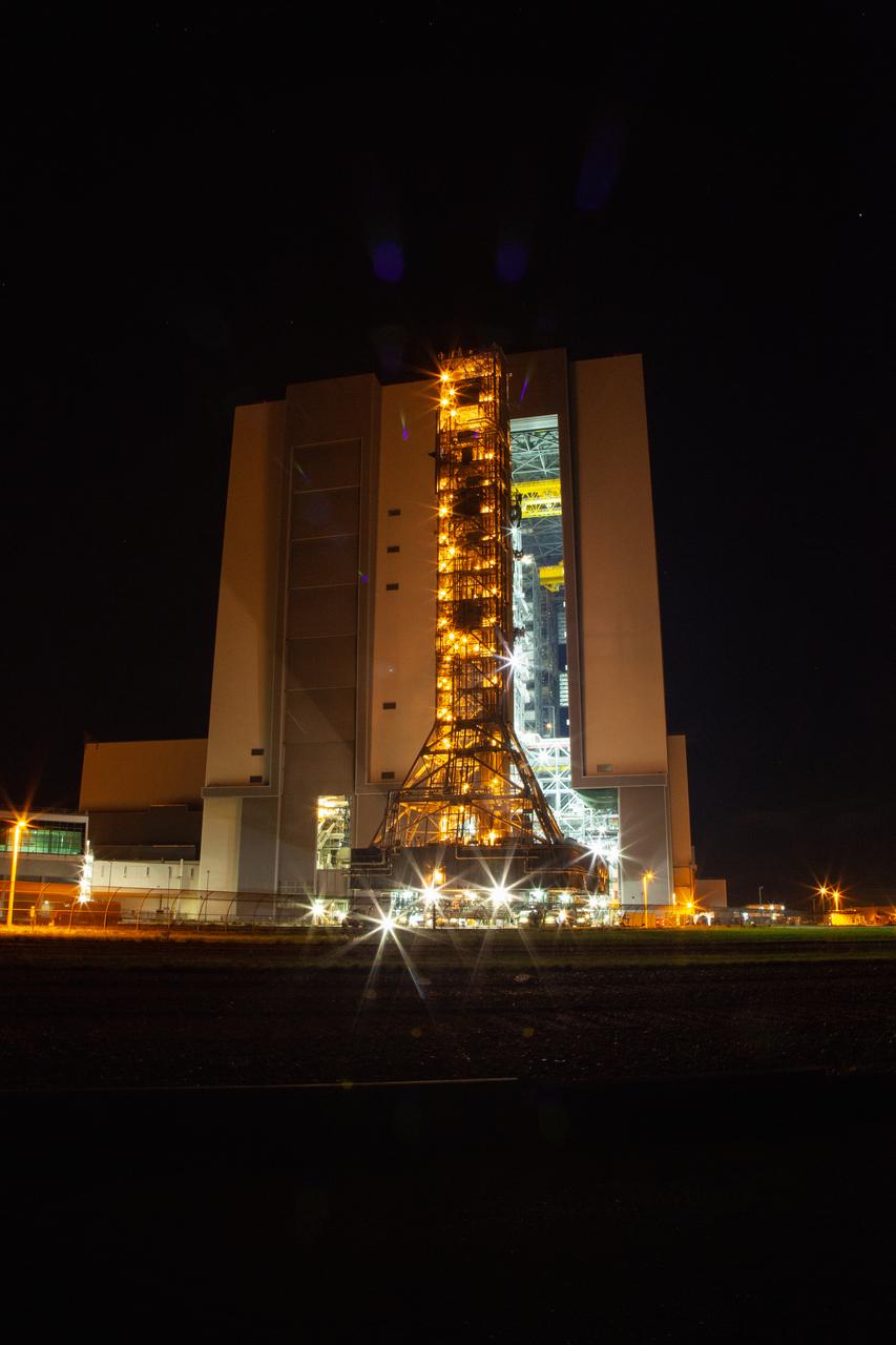 Exploration Ground Systems’ mobile launcher departs from Kennedy Space Center’s Vehicle Assembly Building at midnight on June 27, 2019, for its final solo trek to Launch Complex 39B in Florida. After the 10-hour journey to the pad, the mobile launcher will remain there for the summer, undergoing final testing and checkouts. Its next roll to the pad will be with the agency’s Space Launch System rocket and Orion spacecraft in preparation for the launch of Artemis 1. 