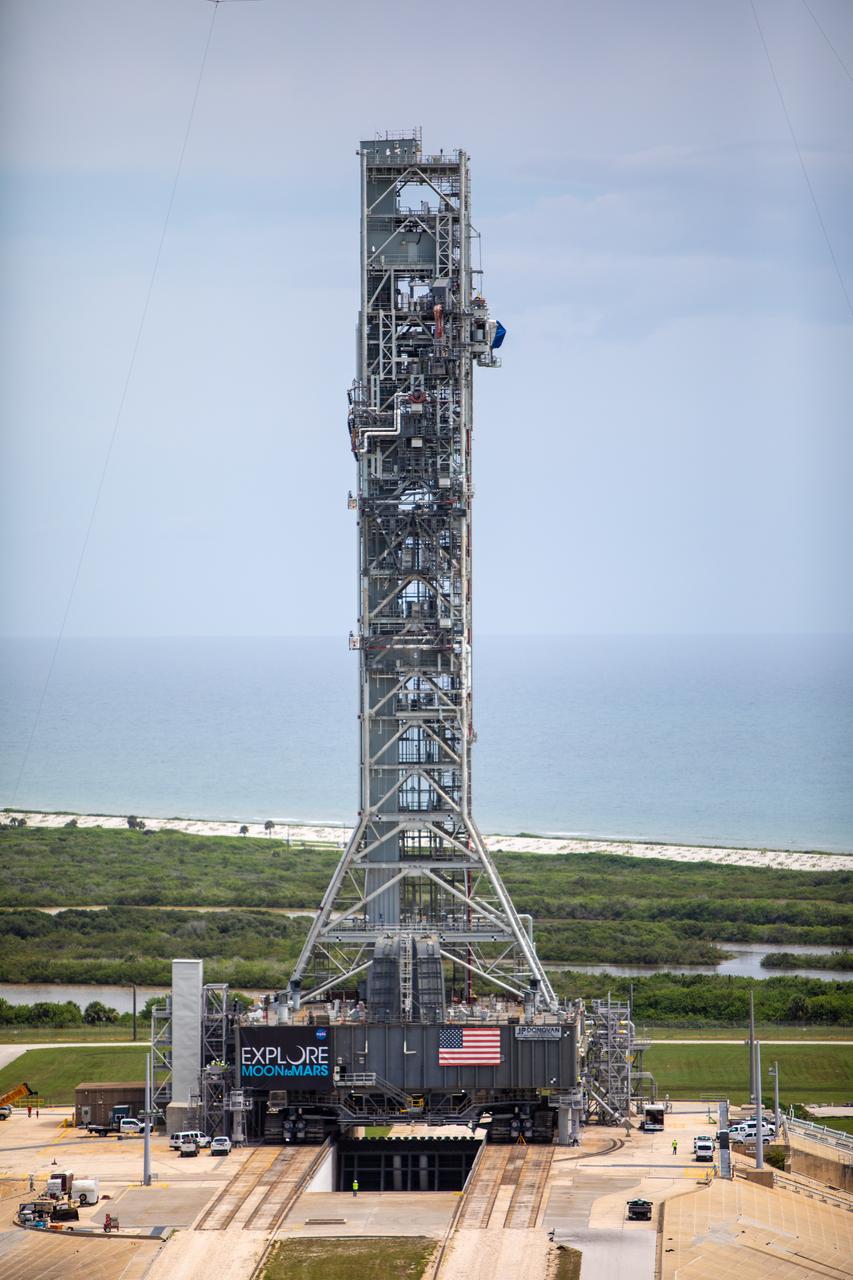 A close-up aerial view of Launch Complex 39B with Exploration Ground Systems’ mobile launcher for the Artemis 1 mission on the pad. The mobile launcher, atop crawler-transporter 2, made its final solo trek from the Vehicle Assembly Building on June 27, 2019, and arrived on the surface of pad B on June 28, 2019, at NASA’s Kennedy Space Center in Florida. The mobile launcher will remain at the pad over the summer, undergoing final testing and checkouts. Its next roll to the pad will be with the agency’s Space Launch System rocket and Orion spacecraft in preparation for the launch of Artemis 1.