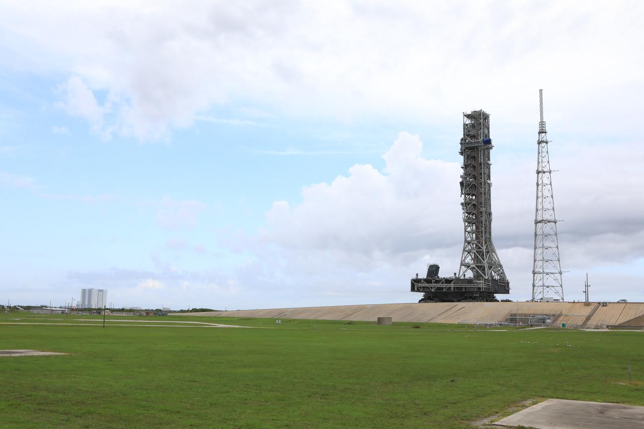 After successfully arriving at Kennedy Space Center’s Launch Complex 39B, Exploration Ground Systems’ mobile launcher is photographed at the pad surface atop crawler-transporter 2 on June 28, 2019. The mobile launcher began its final solo trek to the pad at midnight on June 27, departing from NASA’s Vehicle Assembly Building. The mobile launcher will remain at the pad over the summer, undergoing final testing and checkouts. Its next roll to the pad will be with the agency’s Space Launch System rocket and Orion in preparation for the launch of Artemis 1.
