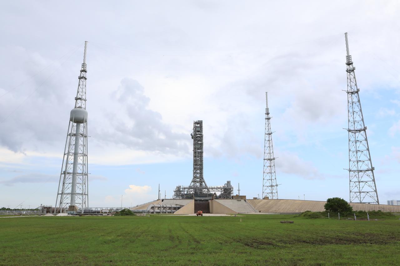 After successfully arriving at Kennedy Space Center’s Launch Complex 39B, Exploration Ground Systems’ mobile launcher is photographed at the pad surface atop crawler-transporter 2 on June 28, 2019. The mobile launcher began its final solo trek to the pad at midnight on June 27, departing from NASA’s Vehicle Assembly Building. The mobile launcher will remain at the pad over the summer, undergoing final testing and checkouts. Its next roll to the pad will be with the agency’s Space Launch System rocket and Orion in preparation for the launch of Artemis 1.
