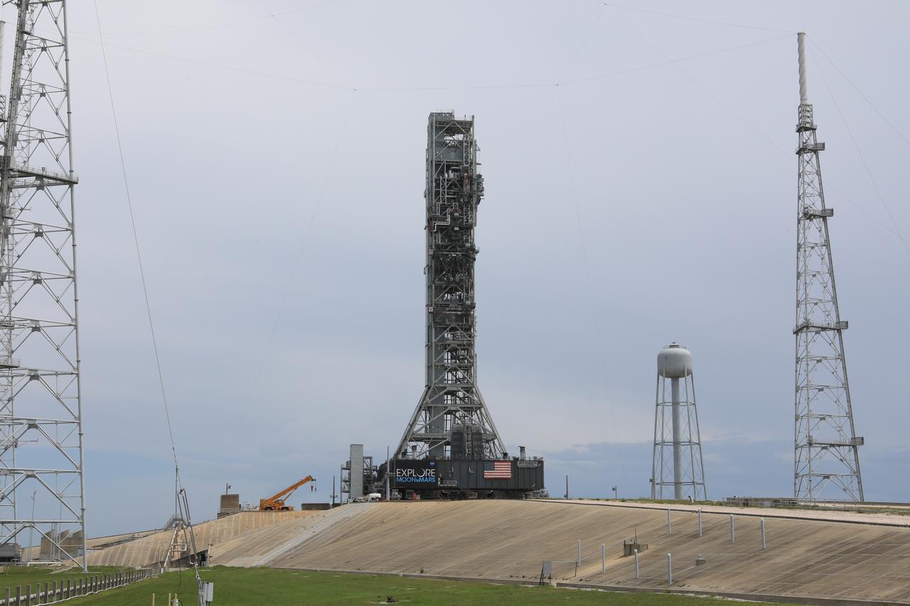After successfully arriving at Kennedy Space Center’s Launch Complex 39B, Exploration Ground Systems’ mobile launcher is photographed at the pad surface on June 28, 2019. The mobile launcher began its final solo trek to the pad at midnight on June 27, departing from NASA’s Vehicle Assembly Building. The mobile launcher will remain at the pad over the summer, undergoing final testing and checkouts. Its next roll to the pad will be with the agency’s Space Launch System rocket and Orion in preparation for the launch of Artemis 1.