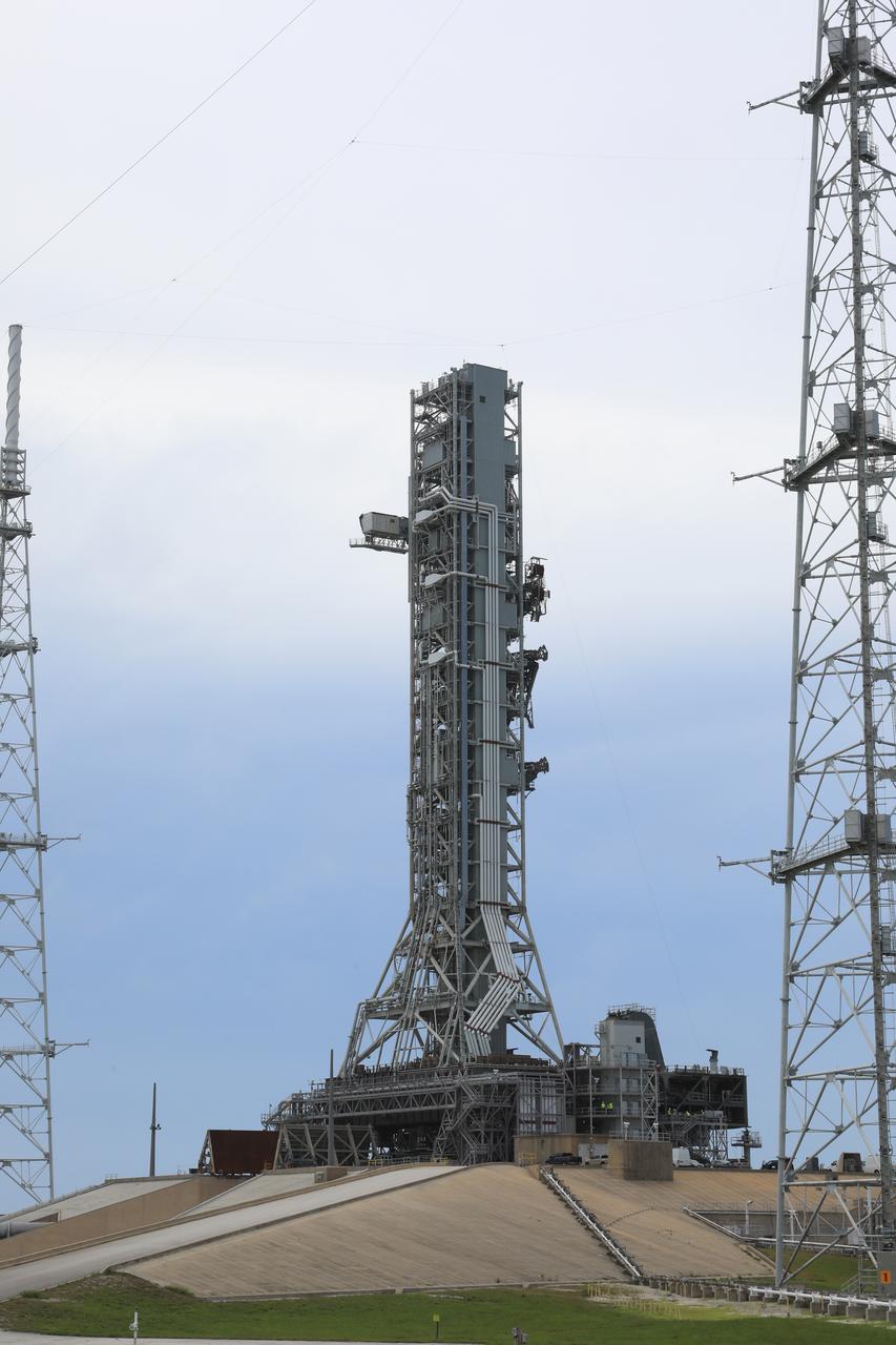 After successfully arriving at Kennedy Space Center’s Launch Complex 39B, Exploration Ground Systems’ mobile launcher is photographed at the pad surface on June 28, 2019. The mobile launcher began its final solo trek to the pad at midnight on June 27, departing from NASA’s Vehicle Assembly Building. The mobile launcher will remain at the pad over the summer, undergoing final testing and checkouts. Its next roll to the pad will be with the agency’s Space Launch System rocket and Orion in preparation for the launch of Artemis 1.