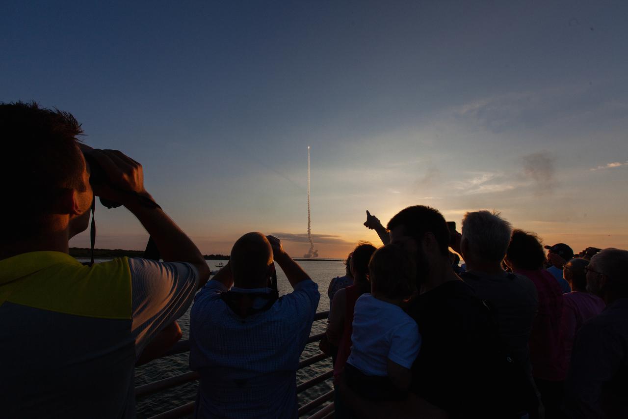 Crowds of spectators watch from Jetty Park in Cape Canaveral, Florida, on July 2, 2019, as a Northrop Grumman provided booster launches from Launch Pad 46 carrying, a fully functional Launch Abort System with a test version of Orion attached for NASA’s Ascent Abort-2 (AA-2). Launch time was 7 a.m. EDT. During AA-2, the booster will send the LAS and Orion to an altitude of 31,000 feet, traveling at Mach 1.15 (more than 1,000 mph). The LAS’ three motors will work together to pull the crew module away from the booster and prepare it for splashdown in the Atlantic Ocean. The flight test will prove that the abort system can pull crew to safety in the unlikely event of an emergency during ascent.