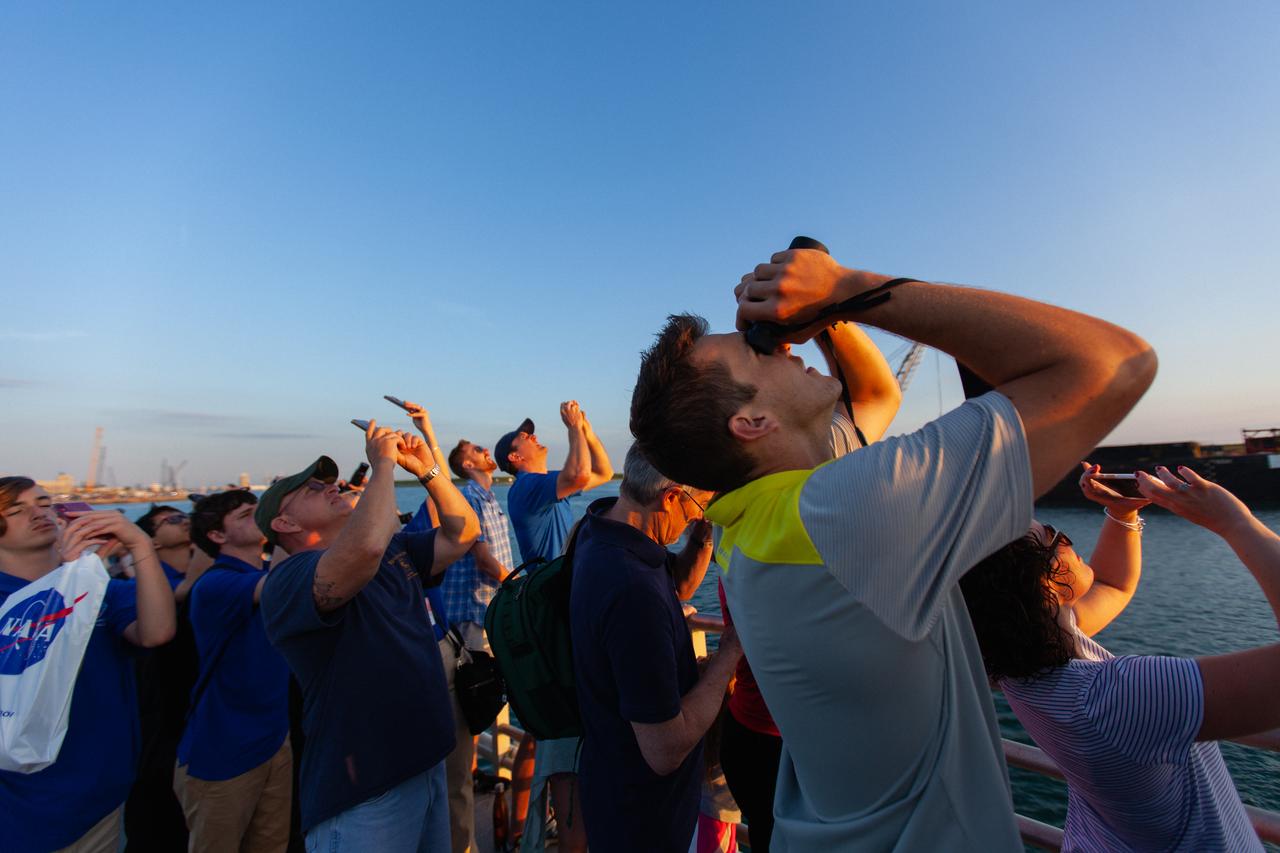 Crowds of spectators watch from Jetty Park in Cape Canaveral, Florida, on July 2, 2019, as a Northrop Grumman provided booster launches from Launch Pad 46 carrying, a fully functional Launch Abort System with a test version of Orion attached for NASA’s Ascent Abort-2 (AA-2). Launch time was 7 a.m. EDT. During AA-2, the booster will send the LAS and Orion to an altitude of 31,000 feet, traveling at Mach 1.15 (more than 1,000 mph). The LAS’ three motors will work together to pull the crew module away from the booster and prepare it for splashdown in the Atlantic Ocean. The flight test will prove that the abort system can pull crew to safety in the unlikely event of an emergency during ascent.