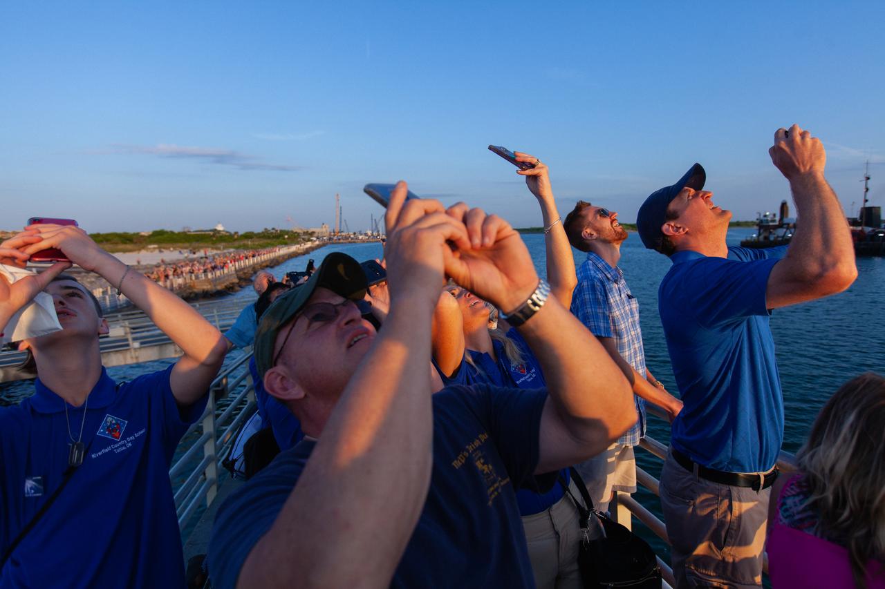 Crowds of spectators watch from Jetty Park in Cape Canaveral, Florida, on July 2, 2019, as a Northrop Grumman provided booster launches from Launch Pad 46 carrying, a fully functional Launch Abort System with a test version of Orion attached for NASA’s Ascent Abort-2 (AA-2). Launch time was 7 a.m. EDT. During AA-2, the booster will send the LAS and Orion to an altitude of 31,000 feet, traveling at Mach 1.15 (more than 1,000 mph). The LAS’ three motors will work together to pull the crew module away from the booster and prepare it for splashdown in the Atlantic Ocean. The flight test will prove that the abort system can pull crew to safety in the unlikely event of an emergency during ascent.
