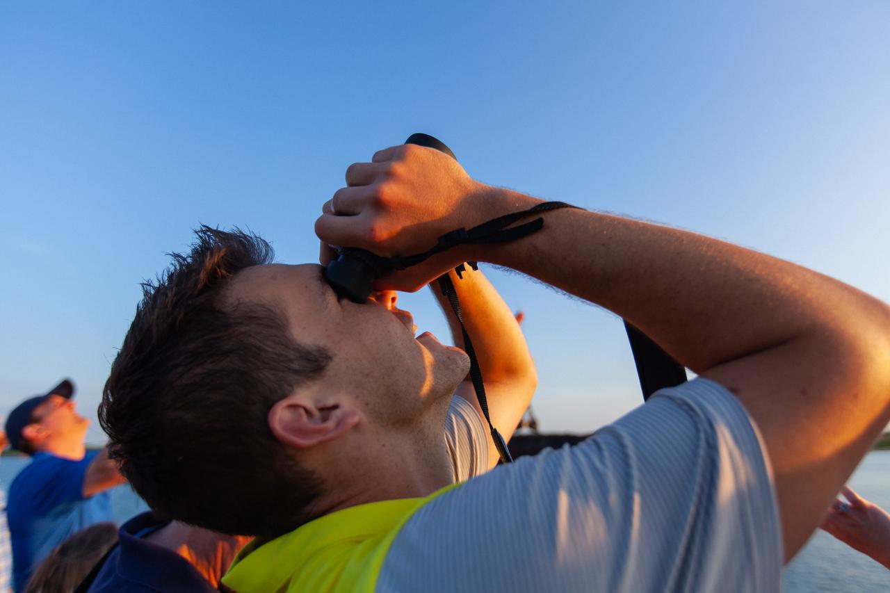 Crowds of spectators watch from Jetty Park in Cape Canaveral, Florida, on July 2, 2019, as a Northrop Grumman provided booster launches from Launch Pad 46 carrying, a fully functional Launch Abort System with a test version of Orion attached for NASA’s Ascent Abort-2 (AA-2). Launch time was 7 a.m. EDT. During AA-2, the booster will send the LAS and Orion to an altitude of 31,000 feet, traveling at Mach 1.15 (more than 1,000 mph). The LAS’ three motors will work together to pull the crew module away from the booster and prepare it for splashdown in the Atlantic Ocean. The flight test will prove that the abort system can pull crew to safety in the unlikely event of an emergency during ascent.