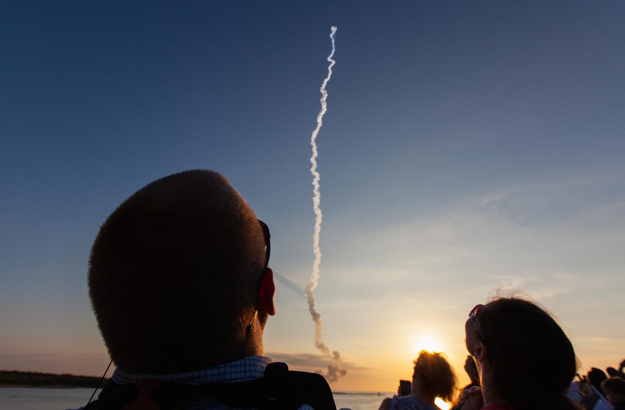 Crowds of spectators watch from Jetty Park in Cape Canaveral, Florida, on July 2, 2019, as a Northrop Grumman provided booster launches from Launch Pad 46 carrying, a fully functional Launch Abort System with a test version of Orion attached for NASA’s Ascent Abort-2 (AA-2). Launch time was 7 a.m. EDT. During AA-2, the booster will send the LAS and Orion to an altitude of 31,000 feet, traveling at Mach 1.15 (more than 1,000 mph). The LAS’ three motors will work together to pull the crew module away from the booster and prepare it for splashdown in the Atlantic Ocean. The flight test will prove that the abort system can pull crew to safety in the unlikely event of an emergency during ascent.