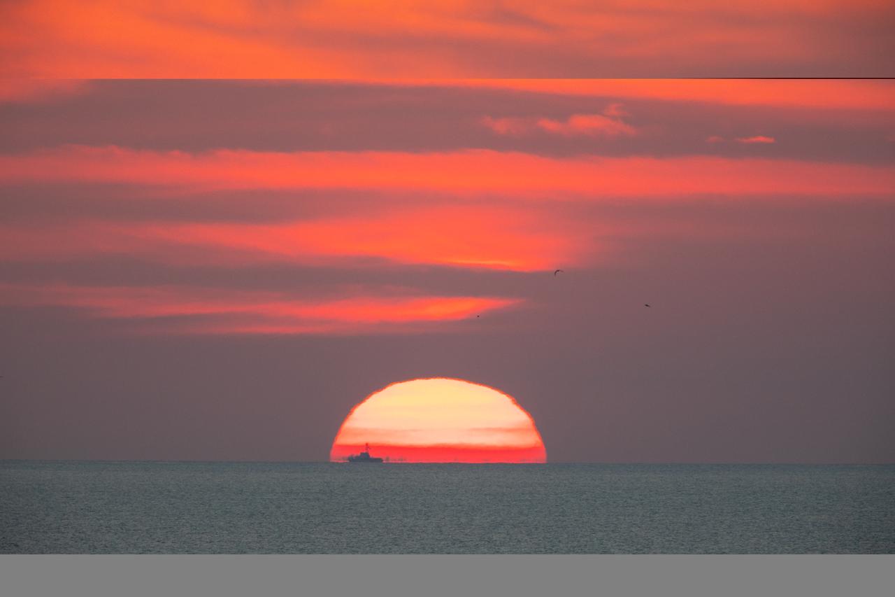 A brilliant sunrise fills the sky before a fully functional Launch Abort System (LAS) with a test version of Orion attached, launches on NASA’s Ascent Abort-2 (AA-2) atop a Northrop Grumman provided booster on July 2, 2019, at 7 a.m. EDT, from Launch Pad 46 at Cape Canaveral Air Force Station in Florida. During AA-2, the booster will send the LAS and Orion to an altitude of 31,000 feet, traveling at Mach 1.15 (more than 1,000 mph). The LAS’ three motors will work together to pull the crew module away from the booster and prepare it for splashdown in the Atlantic Ocean. The flight test will prove that the abort system can pull crew to safety in the unlikely event of an emergency during ascent. 