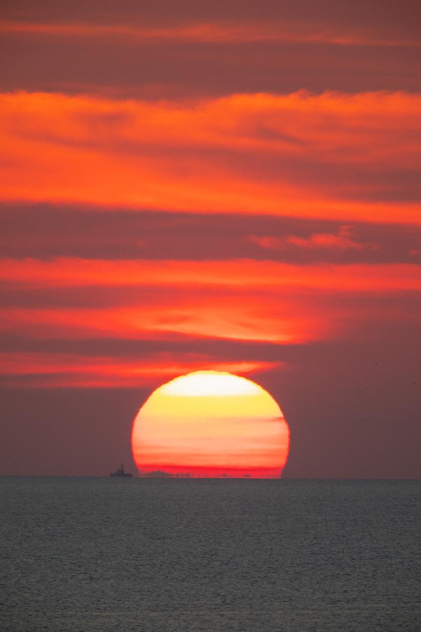 A brilliant sunrise fills the sky before a fully functional Launch Abort System (LAS) with a test version of Orion attached, launches on NASA’s Ascent Abort-2 (AA-2) atop a Northrop Grumman provided booster on July 2, 2019, at 7 a.m. EDT, from Launch Pad 46 at Cape Canaveral Air Force Station in Florida. During AA-2, the booster will send the LAS and Orion to an altitude of 31,000 feet, traveling at Mach 1.15 (more than 1,000 mph). The LAS’ three motors will work together to pull the crew module away from the booster and prepare it for splashdown in the Atlantic Ocean. The flight test will prove that the abort system can pull crew to safety in the unlikely event of an emergency during ascent. 