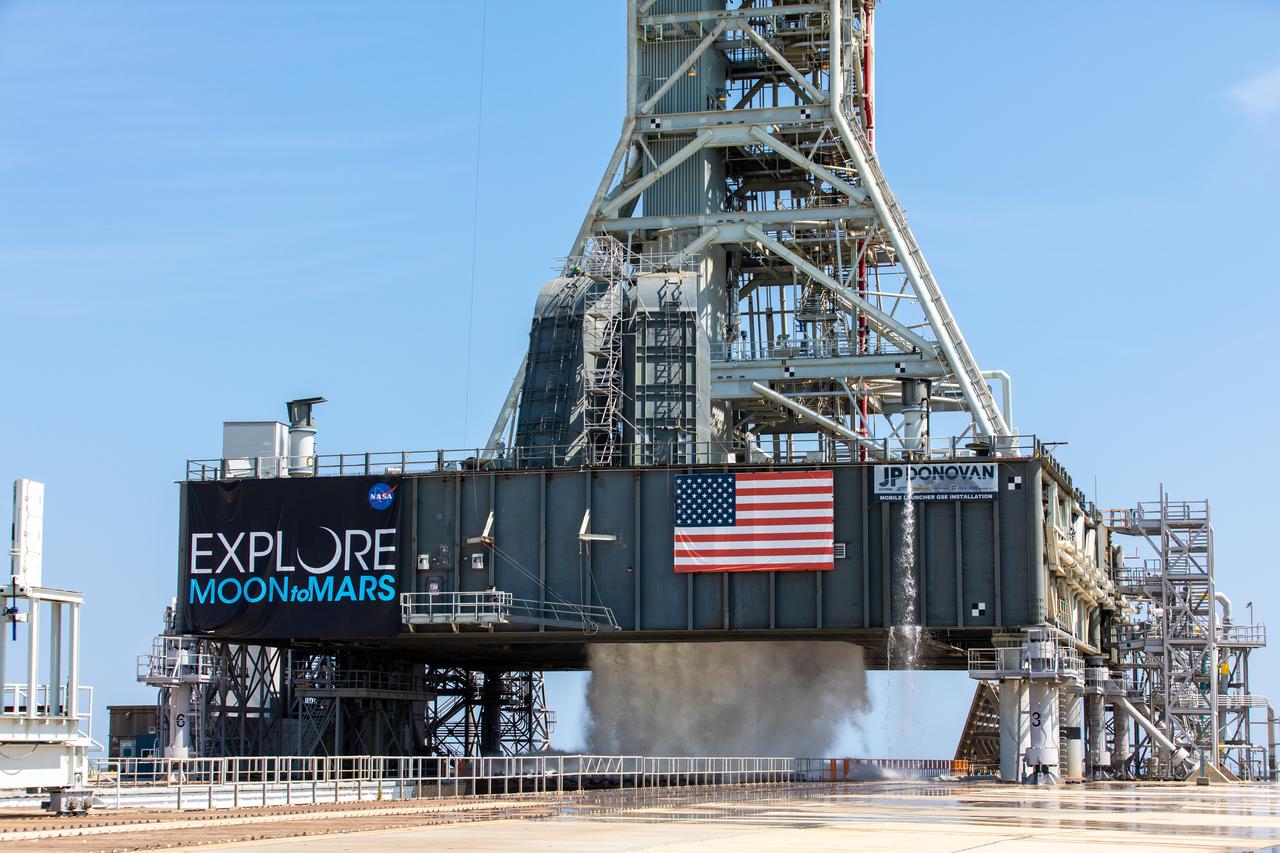 NASA’s Exploration Ground Systems conducts a water flow test with the mobile launcher at Kennedy Space Center’s Pad 39B in Florida on July 2, 2019. It is the first of nine tests to verify the sound suppression system is ready for launch of NASA’s Space Launch System for the first Artemis mission. During launch, 400,000 gallons of water will rush onto the pad to help protect the rocket, NASA’s Orion Spacecraft, mobile launcher, and launch pad from the extreme acoustic and temperature environment.