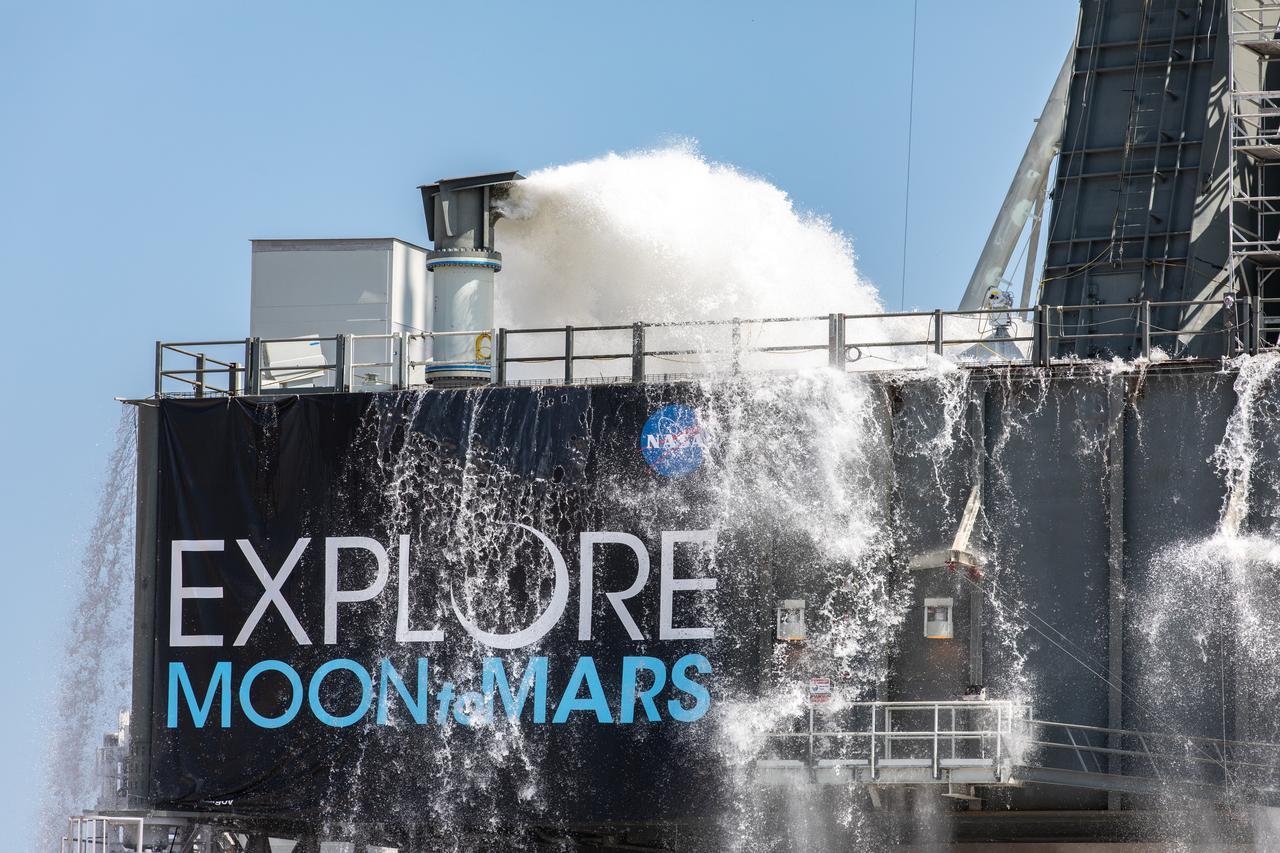NASA’s Exploration Ground Systems conducts a water flow test with the mobile launcher at Kennedy Space Center’s Pad 39B in Florida on July 2, 2019. It is the first of nine tests to verify the sound suppression system is ready for launch of NASA’s Space Launch System for the first Artemis mission. During launch, 400,000 gallons of water will rush onto the pad to help protect the rocket, NASA’s Orion Spacecraft, mobile launcher, and launch pad from the extreme acoustic and temperature environment.