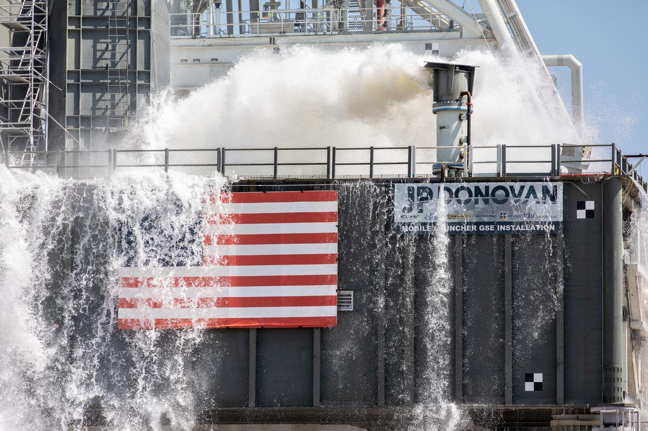 NASA’s Exploration Ground Systems conducts a water flow test with the mobile launcher at Kennedy Space Center’s Pad 39B in Florida on July 2, 2019. It is the first of nine tests to verify the sound suppression system is ready for launch of NASA’s Space Launch System for the first Artemis mission. During launch, 400,000 gallons of water will rush onto the pad to help protect the rocket, NASA’s Orion Spacecraft, mobile launcher, and launch pad from the extreme acoustic and temperature environment.