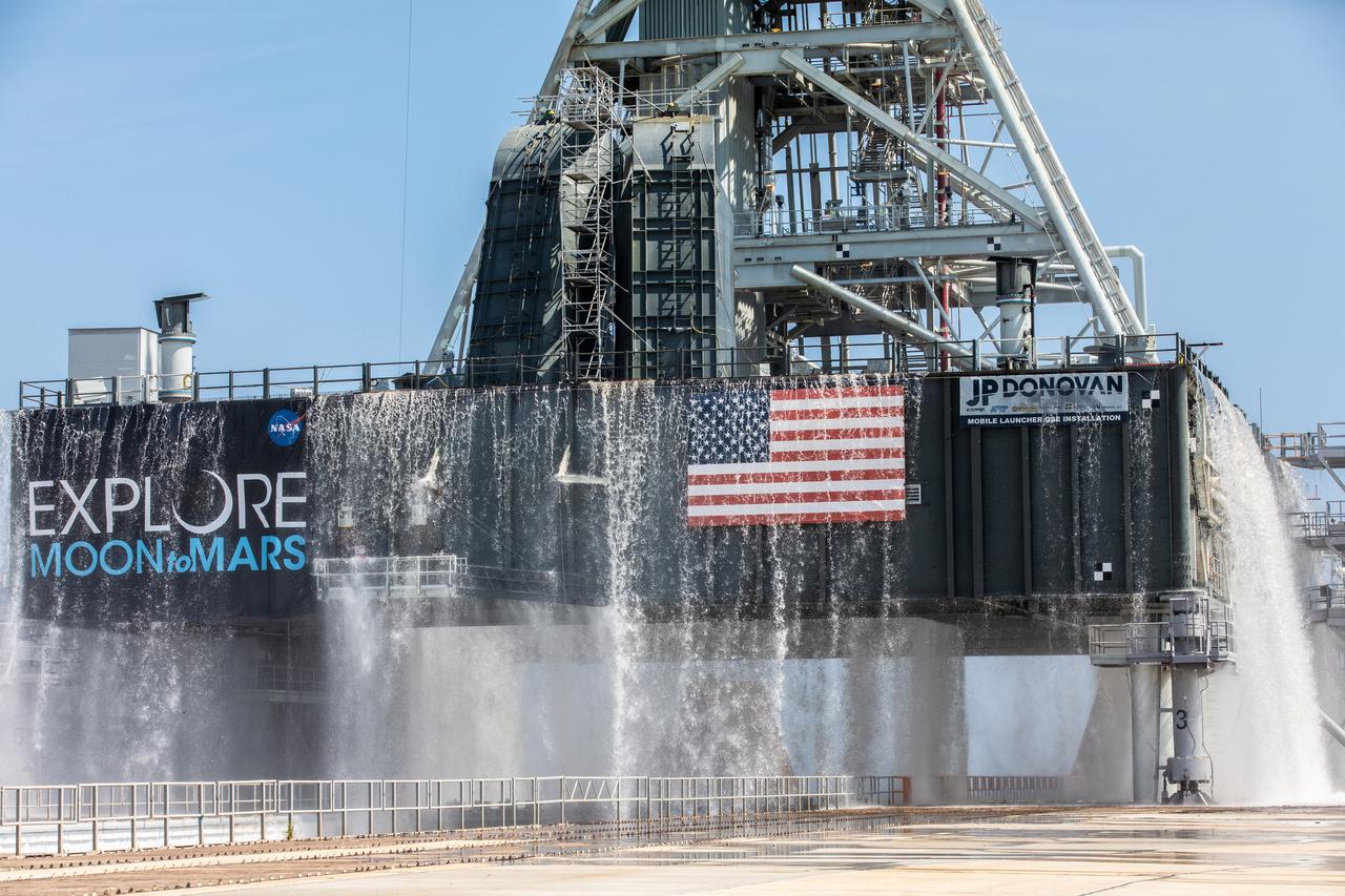 NASA’s Exploration Ground Systems conducts a water flow test with the mobile launcher at Kennedy Space Center’s Pad 39B in Florida on July 2, 2019. It is the first of nine tests to verify the sound suppression system is ready for launch of NASA’s Space Launch System for the first Artemis mission. During launch, 400,000 gallons of water will rush onto the pad to help protect the rocket, NASA’s Orion Spacecraft, mobile launcher, and launch pad from the extreme acoustic and temperature environment.