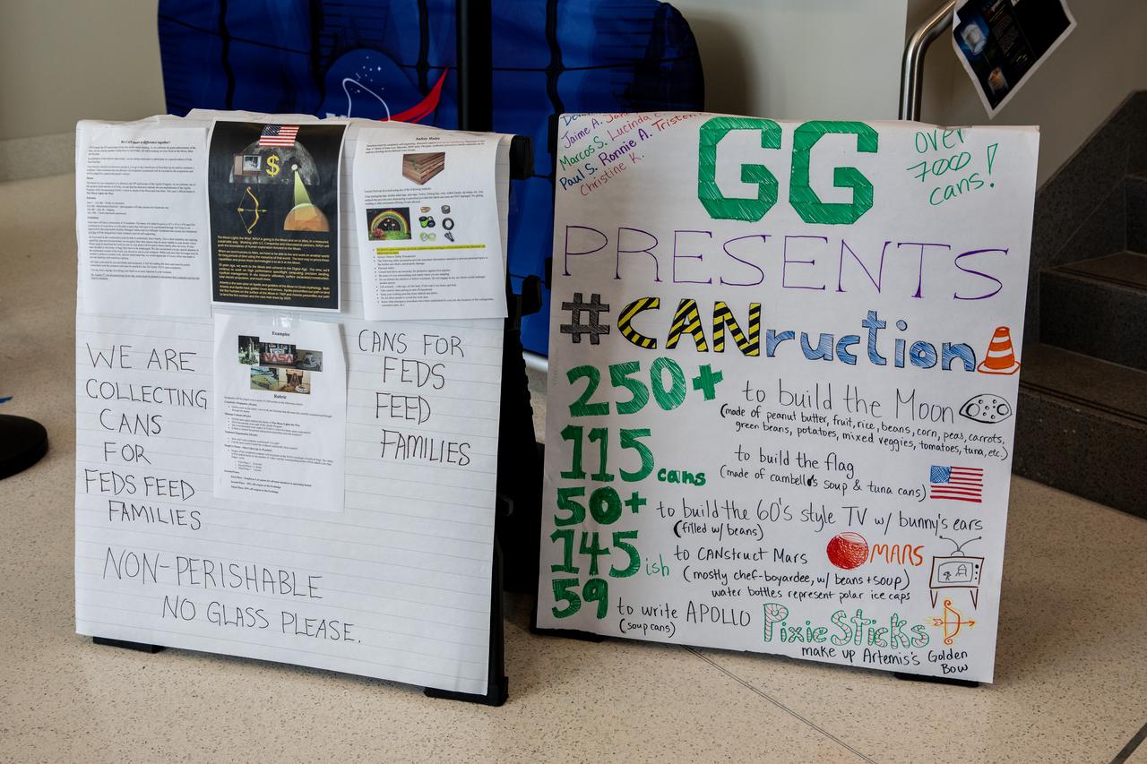 A sign explaining the construction of a sculpture created out of non-perishable canned and boxed foods is on display at NASA’s Kennedy Space Center in Florida as part of the 2019 Feds Feeds Families campaign. Kennedy employees had the opportunity to work in teams to construct sculptures reflecting this year’s theme – The Moon Lights the Way – to pay tribute to the 50th anniversary of the first Apollo Moon landing. As part of the theme, the can sculptures highlighted the accomplishments of the Apollo Program while incorporating aspects of NASA’s aim to return to the Moon and beyond to Mars. On Aug. 2, 2019, all sculptures will be deconstructed and boxed for donation. 