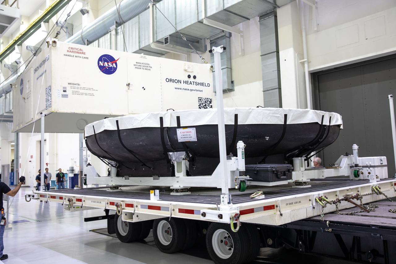 The heat shield for Orion’s Artemis 2 mission, NASA’s first crewed mission, is uncrated from its shipping container inside the Neil Armstrong Operations and Checkout Building high bay at the agency’s Kennedy Space Center in Florida on July 10, 2019. The heat shield, measuring roughly 16 feet in diameter, will protect astronauts upon re-entry on the second mission of Artemis. The heat shield arrived from Lockheed Martin’s manufacturing facility near Denver aboard NASA’s Super Guppy Aircraft. The heat shield is a base titanium truss structure. Over the next several months, technicians will apply Avcoat, an ablative material that will provide the thermal protection. Artemis 2 will confirm all of the spacecraft’s systems operate as designed in the actual environment of deep space with astronauts aboard.
