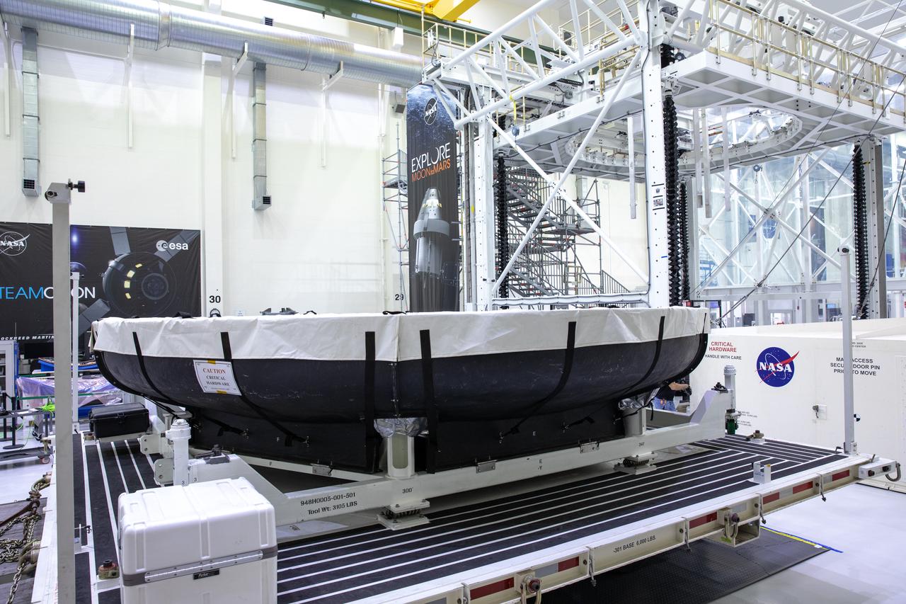 The heat shield for Orion’s Artemis 2 mission, NASA’s first crewed mission, is uncrated from its shipping container inside the Neil Armstrong Operations and Checkout Building high bay at the agency’s Kennedy Space Center in Florida on July 10, 2019. The heat shield, measuring roughly 16 feet in diameter, will protect astronauts upon re-entry on the second mission of Artemis. The heat shield arrived from Lockheed Martin’s manufacturing facility near Denver aboard NASA’s Super Guppy Aircraft. The heat shield is a base titanium truss structure. Over the next several months, technicians will apply Avcoat, an ablative material that will provide the thermal protection. Artemis 2 will confirm all of the spacecraft’s systems operate as designed in the actual environment of deep space with astronauts aboard.