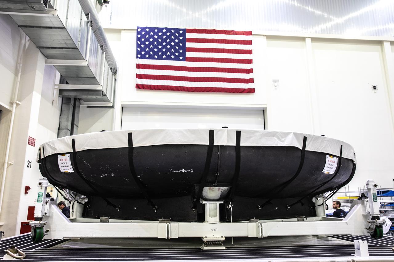 The heat shield for Orion’s Artemis 2 mission, NASA’s first crewed mission, is uncrated in the Neil Armstrong Operations and Checkout Building high bay at the agency’s Kennedy Space Center in Florida on July 9, 2019. The heat shield, measuring roughly 16 feet in diameter, will protect astronauts upon re-entry on the second mission of Artemis. The heat shield arrived from Lockheed Martin’s manufacturing facility near Denver aboard NASA’s Super Guppy Aircraft. The heat shield is a base titanium truss structure. Over the next several months, technicians will apply Avcoat, an ablative material that will provide the thermal protection. Artemis 2 will confirm all of the spacecraft’s systems operate as designed in the actual environment of deep space with astronauts aboard.
