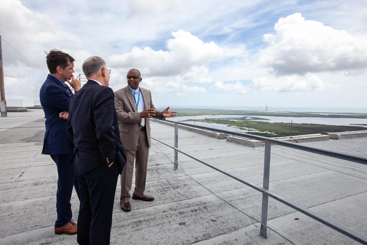 Kelvin Manning, right, associate director, technical, of NASA’s Kennedy Space Center in Florida, speaks to White House Office of Science and Technology Policy Director Kelvin Droegemeier, center, and NASA Associate Administrator for STEM Engagement Mike Kincade, left, on the roof of the Vehicle Assembly Building on July 10, 2019. Droegemeier visited the iconic rocket-assembly facility in the heart of Kennedy’s Launch Complex 39 Area during a tour of the multi-user spaceport. 