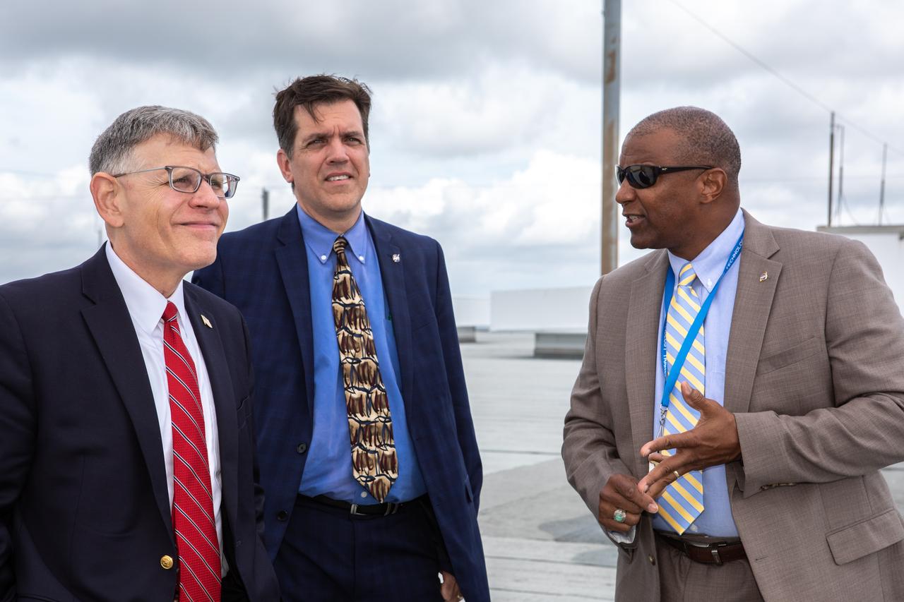 Kelvin Manning, right, associate director, technical, of NASA’s Kennedy Space Center in Florida, speaks to White House Office of Science and Technology Policy Director Kelvin Droegemeier, left, and NASA Associate Administrator for STEM Engagement Mike Kincade, center, on the roof of the Vehicle Assembly Building on July 10, 2019. Droegemeier visited the iconic rocket-assembly facility in the heart of Kennedy’s Launch Complex 39 Area during a tour of the multi-user spaceport. 