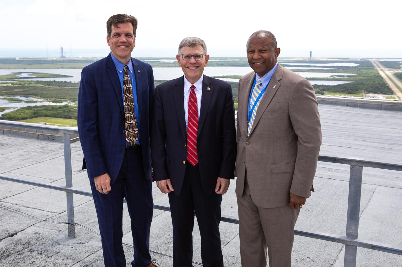 NASA Associate Administrator for STEM Engagement Mike Kincade, left, White House Office of Science and Technology Policy Director Kelvin Droegemeier, center, and Kelvin Manning, right, associate director, technical, of NASA’s Kennedy Space Center in Florida, pause for a photo on the roof of the Vehicle Assembly Building on July 10, 2019. Droegemeier visited the iconic rocket-assembly facility in the heart of Kennedy’s Launch Complex 39 Area during a tour of the multi-user spaceport. 