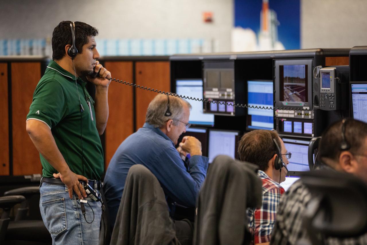 Members of the Artemis 1 launch team, including personnel with NASA’s Exploration Ground Systems (EGS) and Jacobs Test and Operations Contract (TOSC), participate in validation testing inside Firing Room 1 in the Launch Control Center at NASA’s Kennedy Space Center in Florida on July 11, 2019.  The simulation was designed to validate the firing room consoles and communications systems, as well as the new Spaceport Command and Control System (SCCS), which will operate, monitor and coordinate ground equipment in preparation for Artemis 1, the uncrewed first flight of the Space Launch System rocket and Orion spacecraft. 