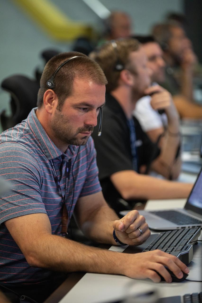A member of the Artemis 1 launch team participates in validation testing inside Firing Room 1 in the Launch Control Center at NASA’s Kennedy Space Center in Florida on July 11, 2019.  The team includes personnel with NASA’s Exploration Ground Systems (EGS) and Jacobs Test and Operations Contract (TOSC). The simulation was designed to validate the firing room consoles and communications systems, as well as the new Spaceport Command and Control System (SCCS), which will operate, monitor and coordinate ground equipment in preparation for Artemis 1, the uncrewed first flight of the Space Launch System rocket and Orion spacecraft. 